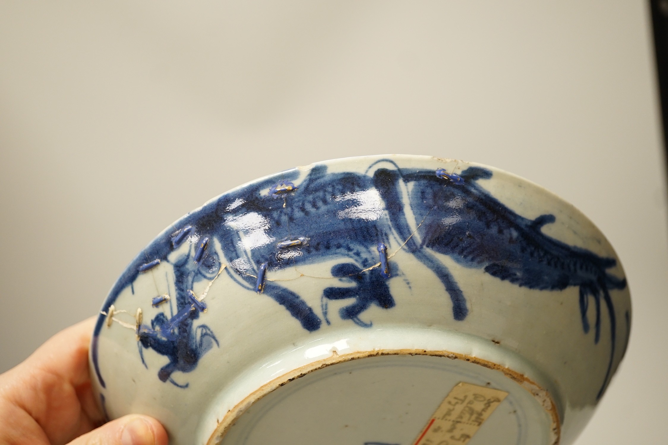 Two 19th century Chinese blue and white dishes and two 18th century tea bowls, largest 23cm diameter